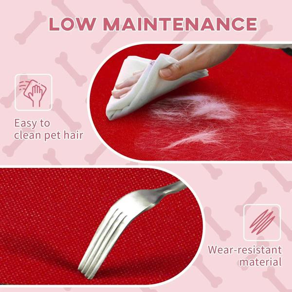 Red elevated pet bed surface being wiped clean with a cloth