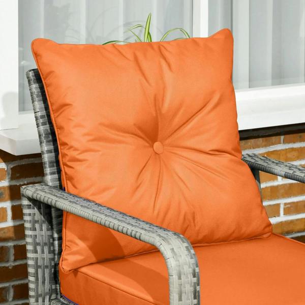 Orange tufted chair back cushion on gray resin wicker bistro chair frame