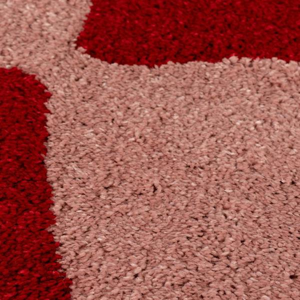 Close-up of red and brown textured carpet