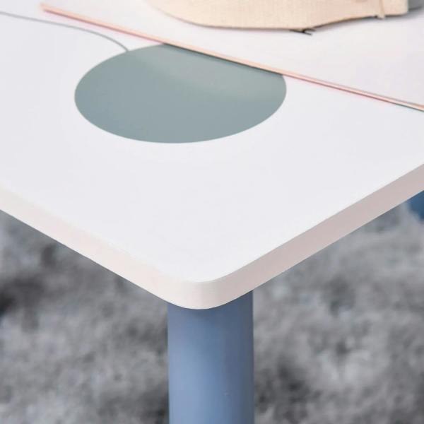 Rounded-edge white tabletop corner with blue leg on kids table and chair set