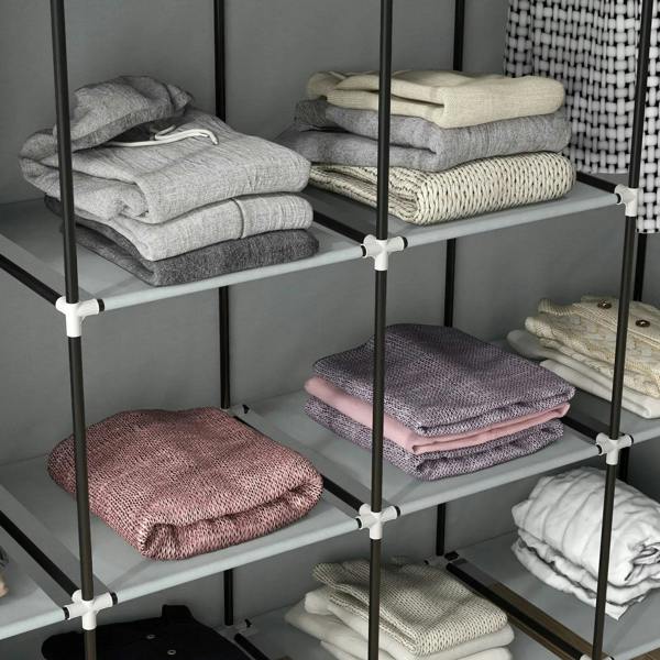 Dark grey fabric wardrobe shelves with neatly folded clothes and stacked fabric drawers