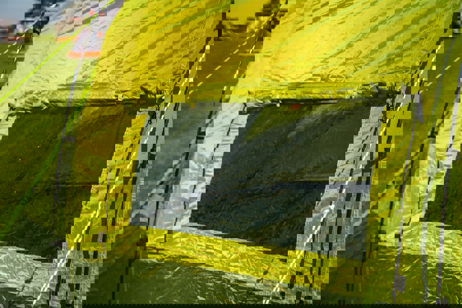 The clear window panel of the Abberley XL 4 Berth Tent by OLPRO.