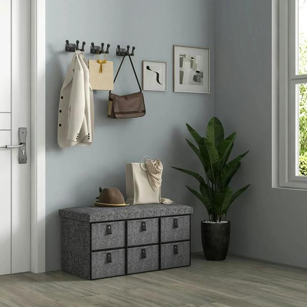 Dark grey six-drawer shoe storage bench with padded top seat and fabric texture