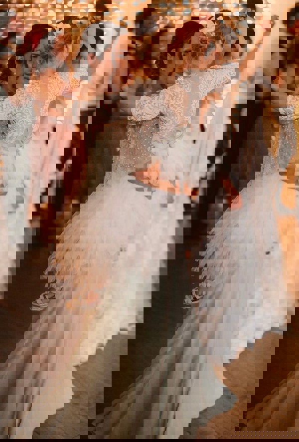 Lady with flower girl dancing