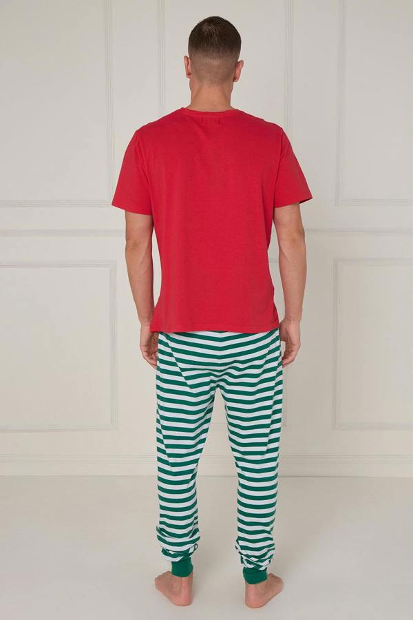 Man wearing a red t-shirt and green striped pants against a white background