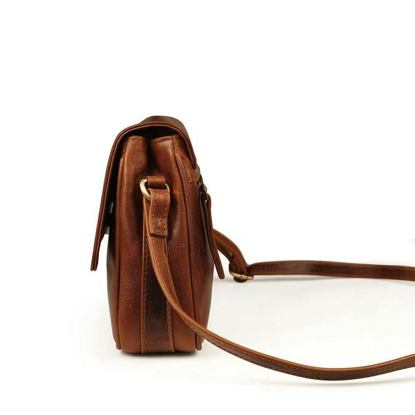 Side profile of Orion women’s brown leather handbag showing strap attachment.