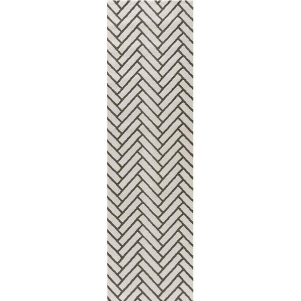 Rectangular area rug with a geometric pattern on a white background