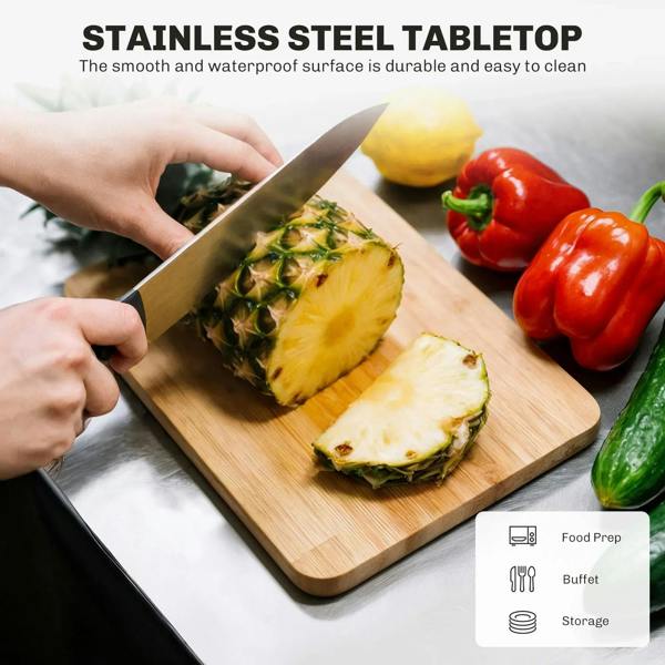 Stainless steel tabletop for cutting, on a black kitchen island serving cart