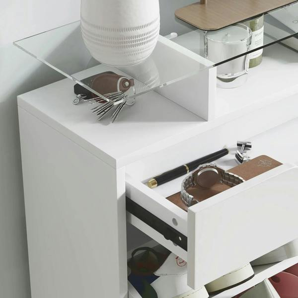 Pull-out drawer inside a white shoe storage cabinet with compartment space for shoes
