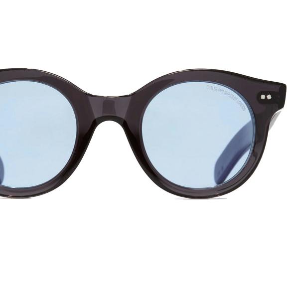 Cutler & Gross 1390 round sunglasses in black on blue