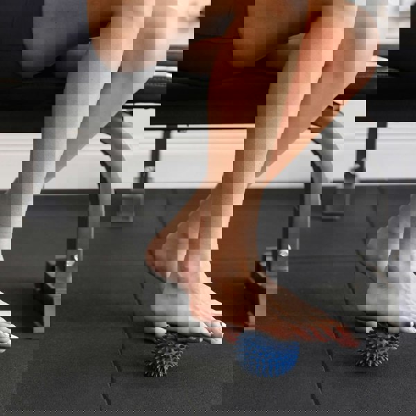 Foot Massage with the Fitness Mad Spikey Massage Ball - 9cm - Blue