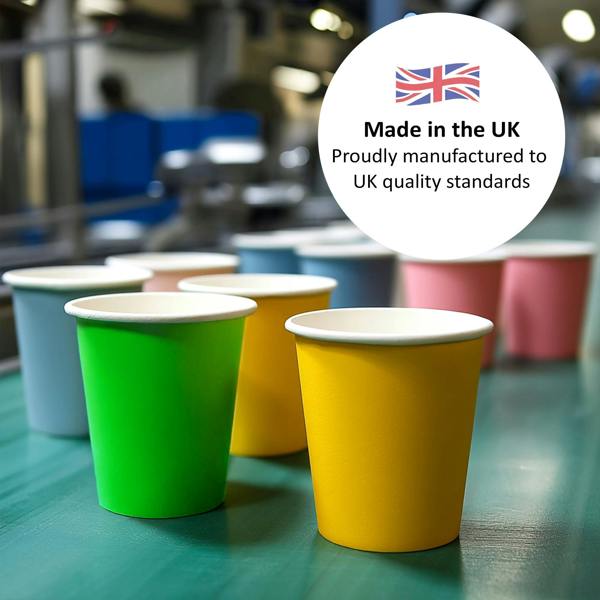 Colourful paper cups on a green surface with a 'Made in the UK' label.