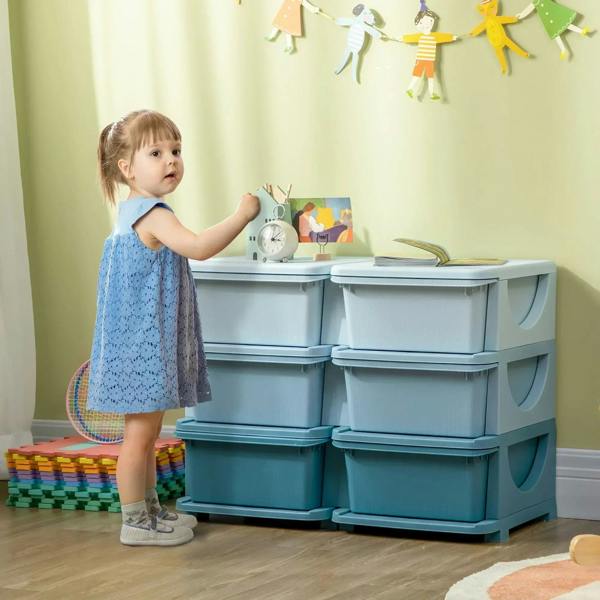 Light blue kids storage unit with tabletop and six front drawer bins in a playroom