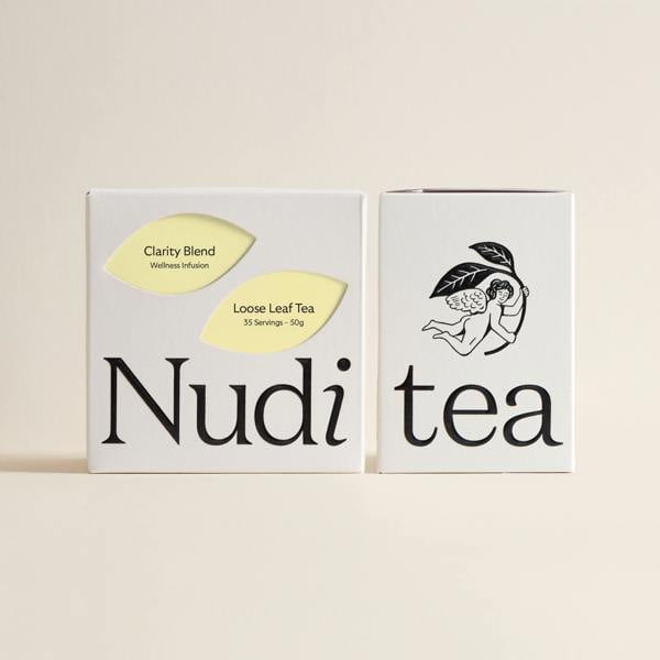 Nuditea clarity blend luxury tea box decorated with bright lemon and soft yellow leaves.