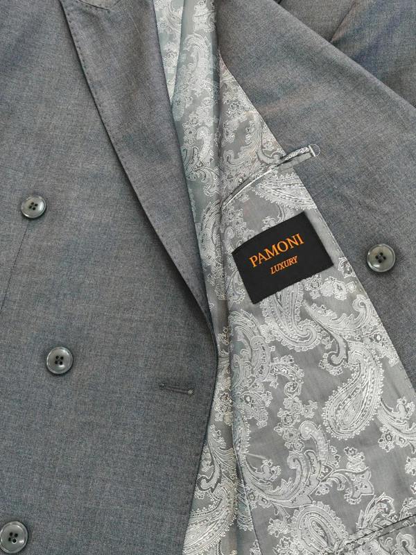 Close-up of a gray double-breasted suit jacket with a patterned gray and white paisley lining and a black PAMONI brand label.