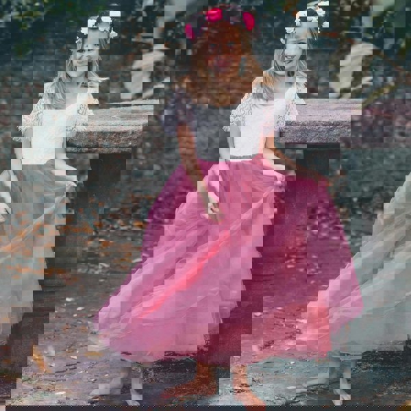 Girl in pink and white dress