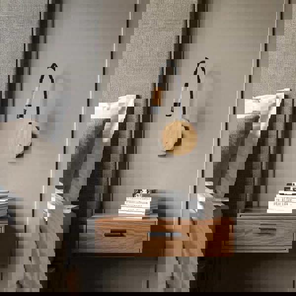 beech wood flexible wooden reading lamp mounted on the wall next to a bed over a bedside table