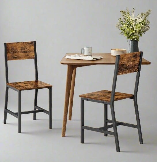 Set of 2 industrial dining chairs with black steel frames and rustic brown seats


