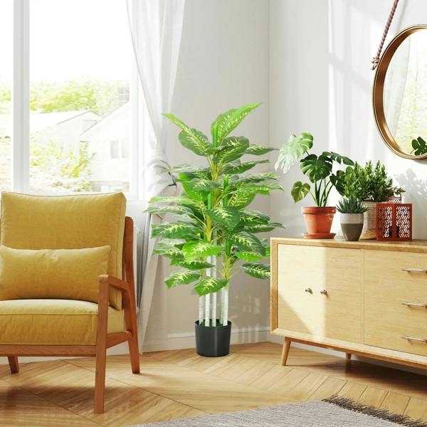 Artificial evergreen tree in black pot with bright green glossy leaves