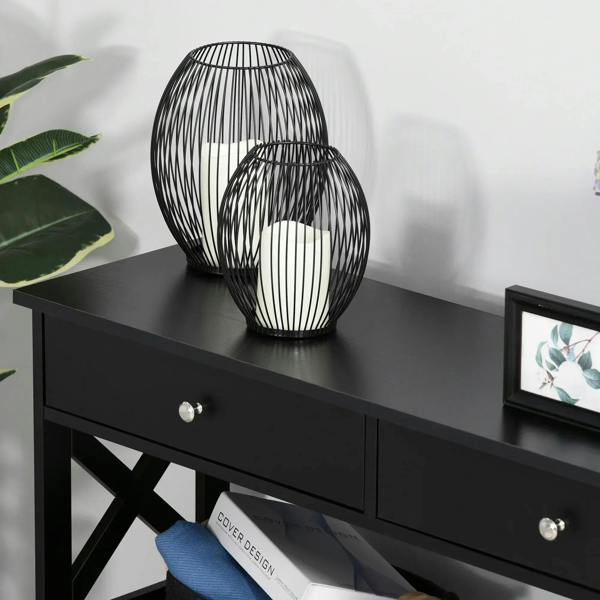 Black side desk console table close-up with two drawers, round knobs, and X-frame legs