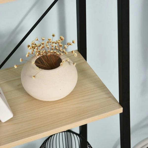 Close-up of the top shelf on a black-and-light wood 4-tier ladder shelf