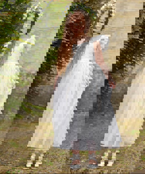 Pretty girl wearing dress by UK Flower Girl Boutique