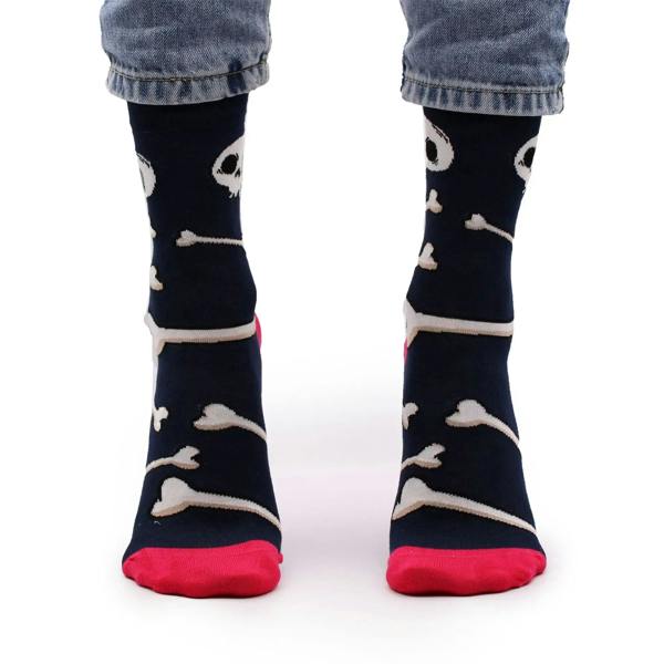 Pair of navy blue bamboo crew socks with skull-and-bones print, red toe and heel.