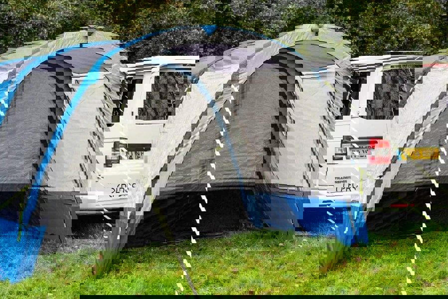 An image of the OLPRO Blue Cocoon Breeze Campervan Awning Extension attached to the Cocoon Breeze that has been fixed to a VW Campervan.
