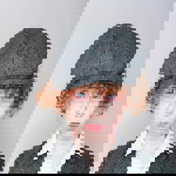 Boy wearing baker boy cap