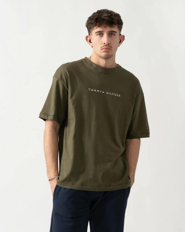 studio shot of a model wearing a Tommy Hilfiger Logo Mens Lounge Tee in Army Green