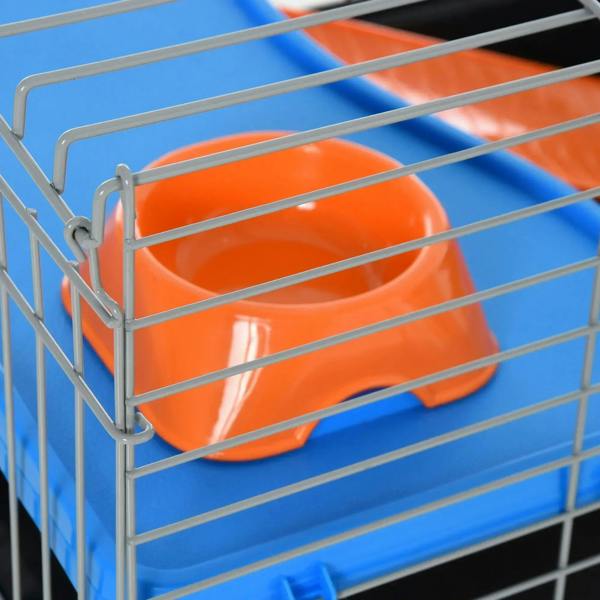 Orange feed dish on blue plastic platform inside black wire cage