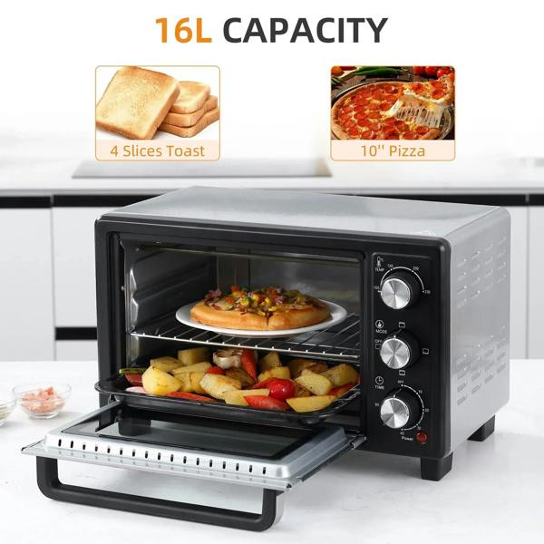 Black countertop oven open with pizza and roasted vegetables on the rack