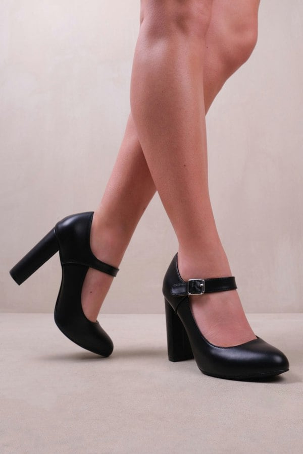 Where's That From Michelle Block High Heel Pump With Front Buckle Strap in Black Faux Leather