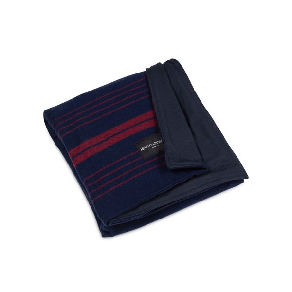 Product shot of Wool and wax picnic blanket with corner folded to show off waxed waterproof backing