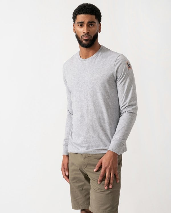 model wearing a Parajumpers Kip Mens Long Sleeve T-Shirt in Ash Grey Melange