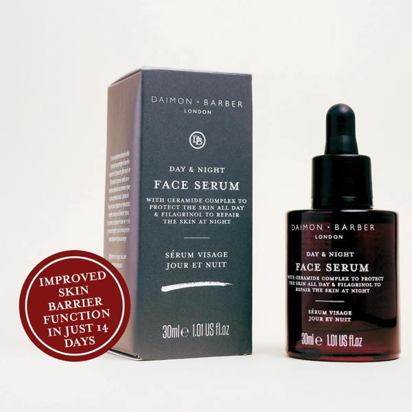 Day & Night Face Serum bottle next to box on white background with benefits text in red circle on white background