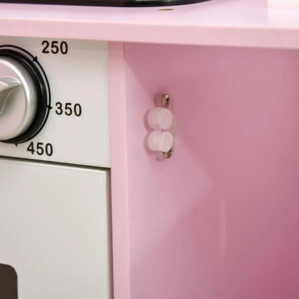 Pink side panel of kids kitchen playset with molded handle and control dial numbers