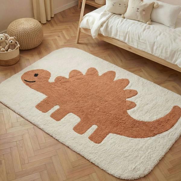 Dinosaur-shaped rug on a wooden floor with a bed and toys in the background