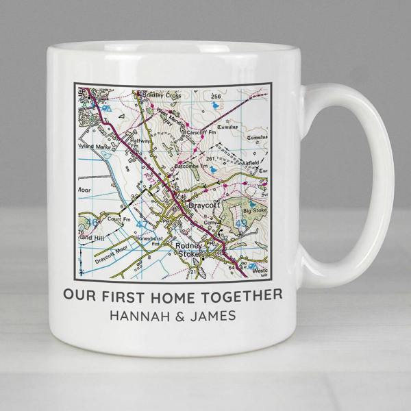 A personalised white ceramic mug displaying a detailed Ordnance Survey map centred on Draycott and text that reads "OUR FIRST HOME TOGETHER HANNAH & JAMES".