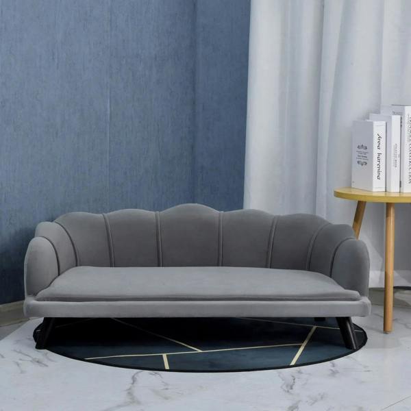 Grey pet couch with tufted back, padded seat, and low legs