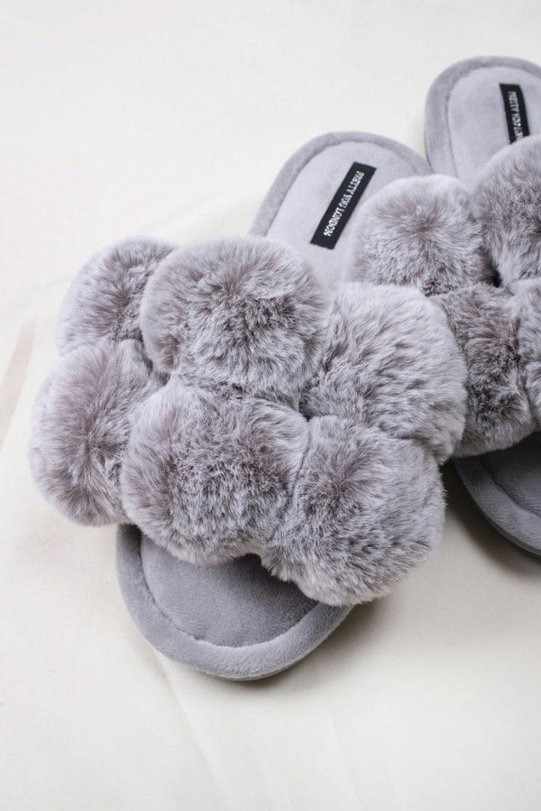 Dolly women's slider slippers in grey with oversized faux fur pom poms from Pretty You London