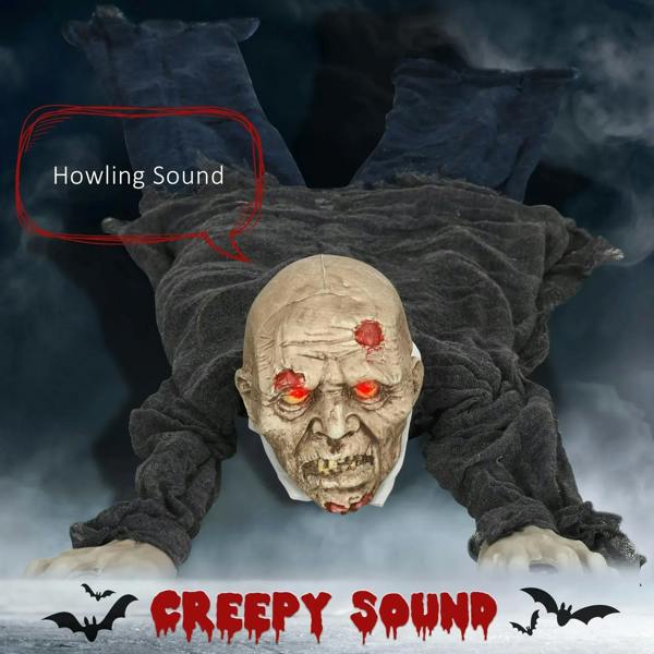 Creepy crawling zombie prop with glowing red eyes and tattered grey body, front view