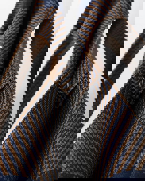 closure detail of Ilse Jacobsen Knitty Womens Knitted Bag in Dark Indigo and Buckthorn Brown