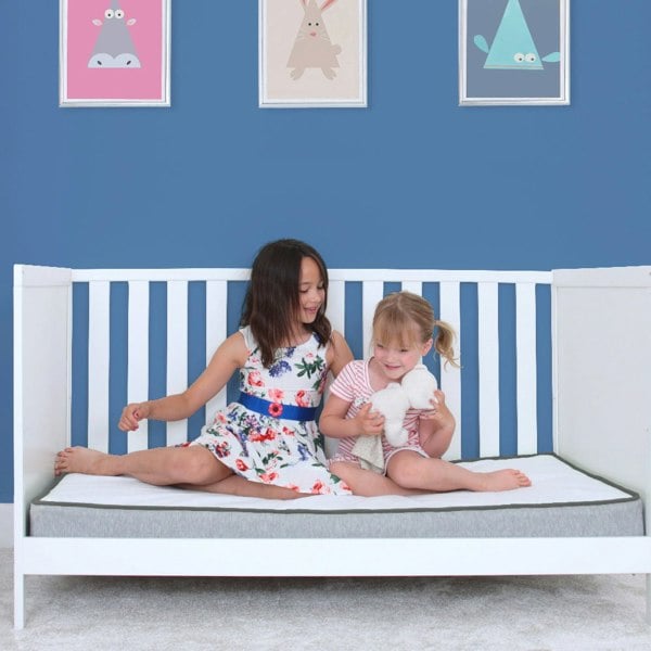 Girls sitting on the kub comfy mattress