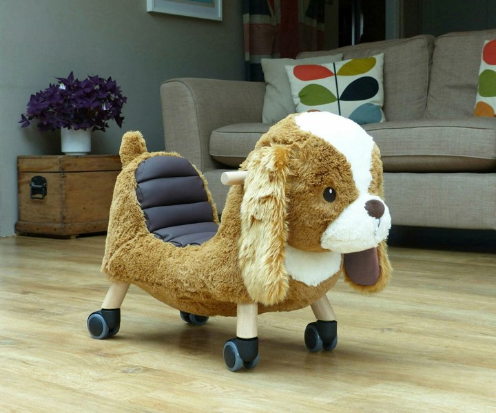 Side image of Peanut Pup Animal Ride on on wooden floor in living room Ride on toys for toddlers