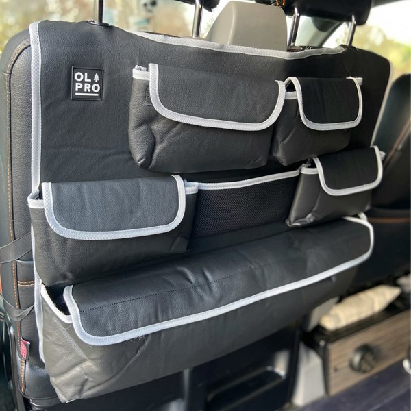 The OLPRO Rear Double Seat Storage Organiser in Grey that is empty and attached to the back of the front campervan seats.