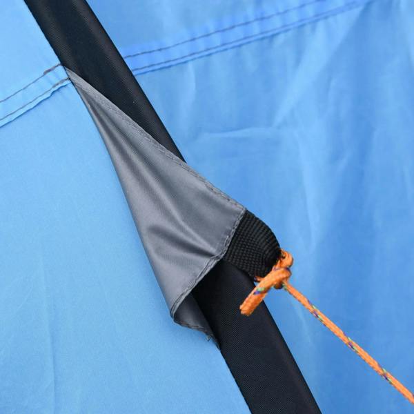 Tent guyline tie-down with orange rope and dark fabric panel edge