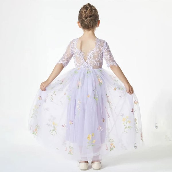 girl wearing a lilac embroidered dress 