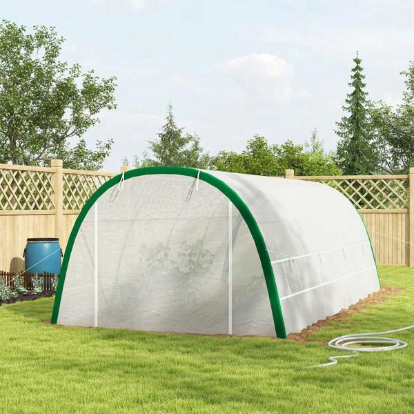 White greenhouse tunnel tent with green frame, centered entrance on backyard lawn