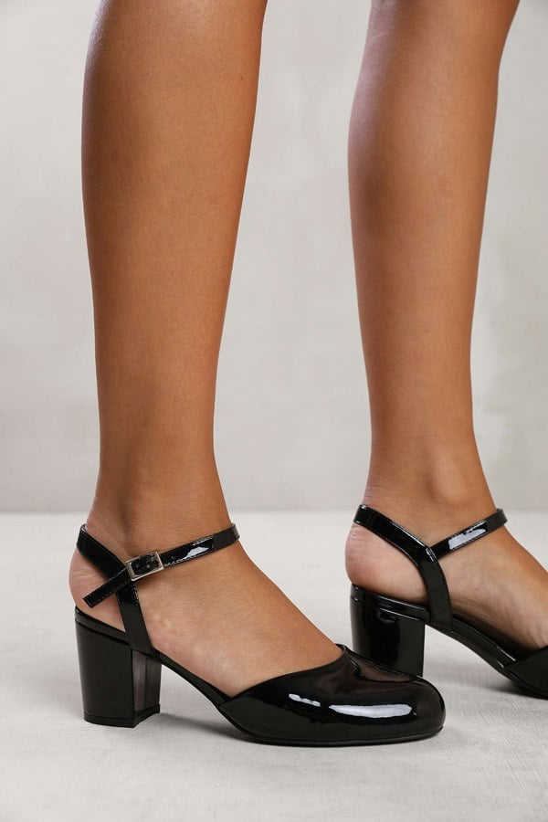 Where's That From Guelder Wide Fit Round Toe Mid Block Heel With Strap in Black Patent